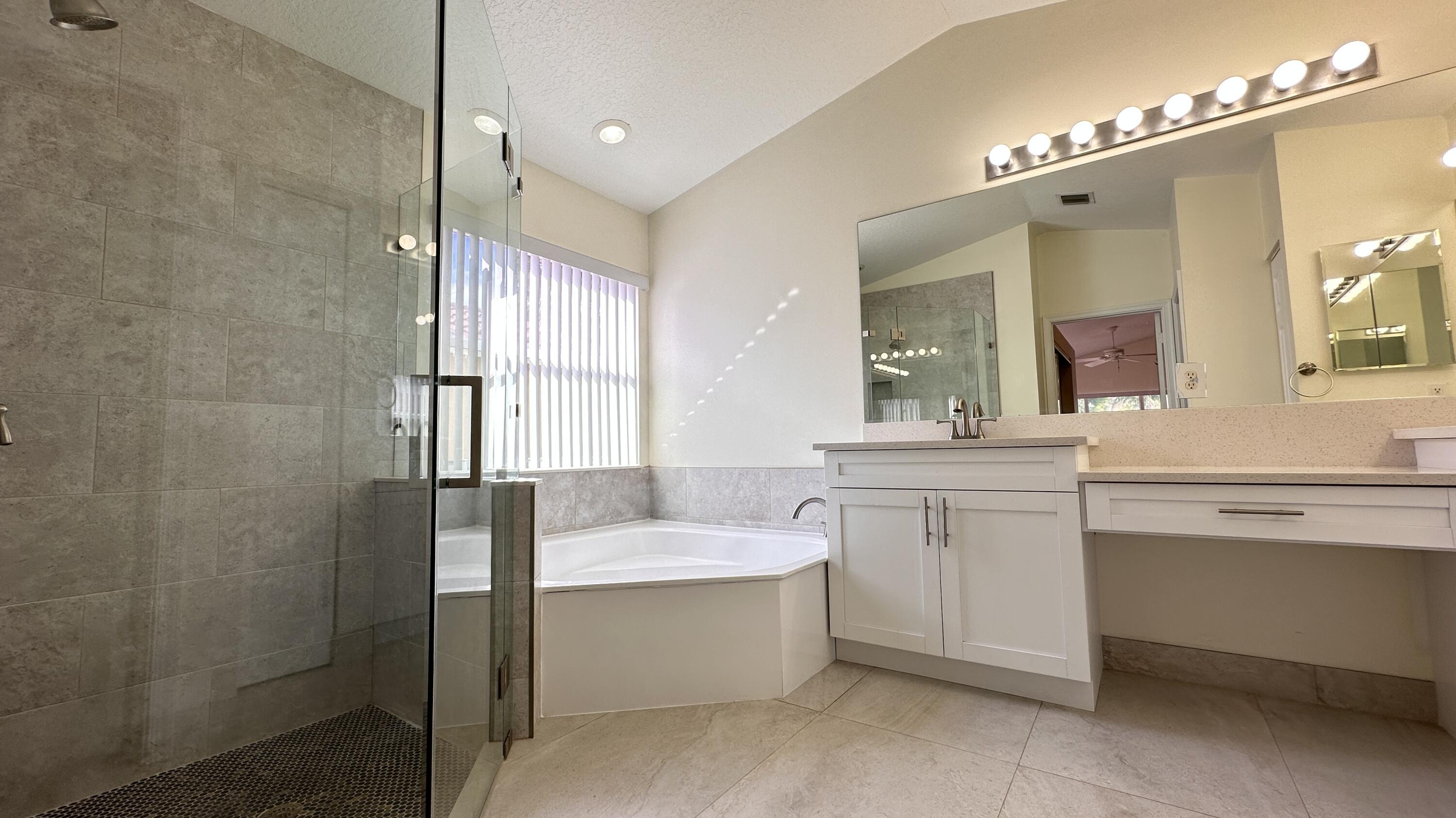 19010 Southwest 10th Street Pembroke Pines, FL 33029 - Photo 40 of 59 a bathroom with a double vanity sink mirror and bathtub