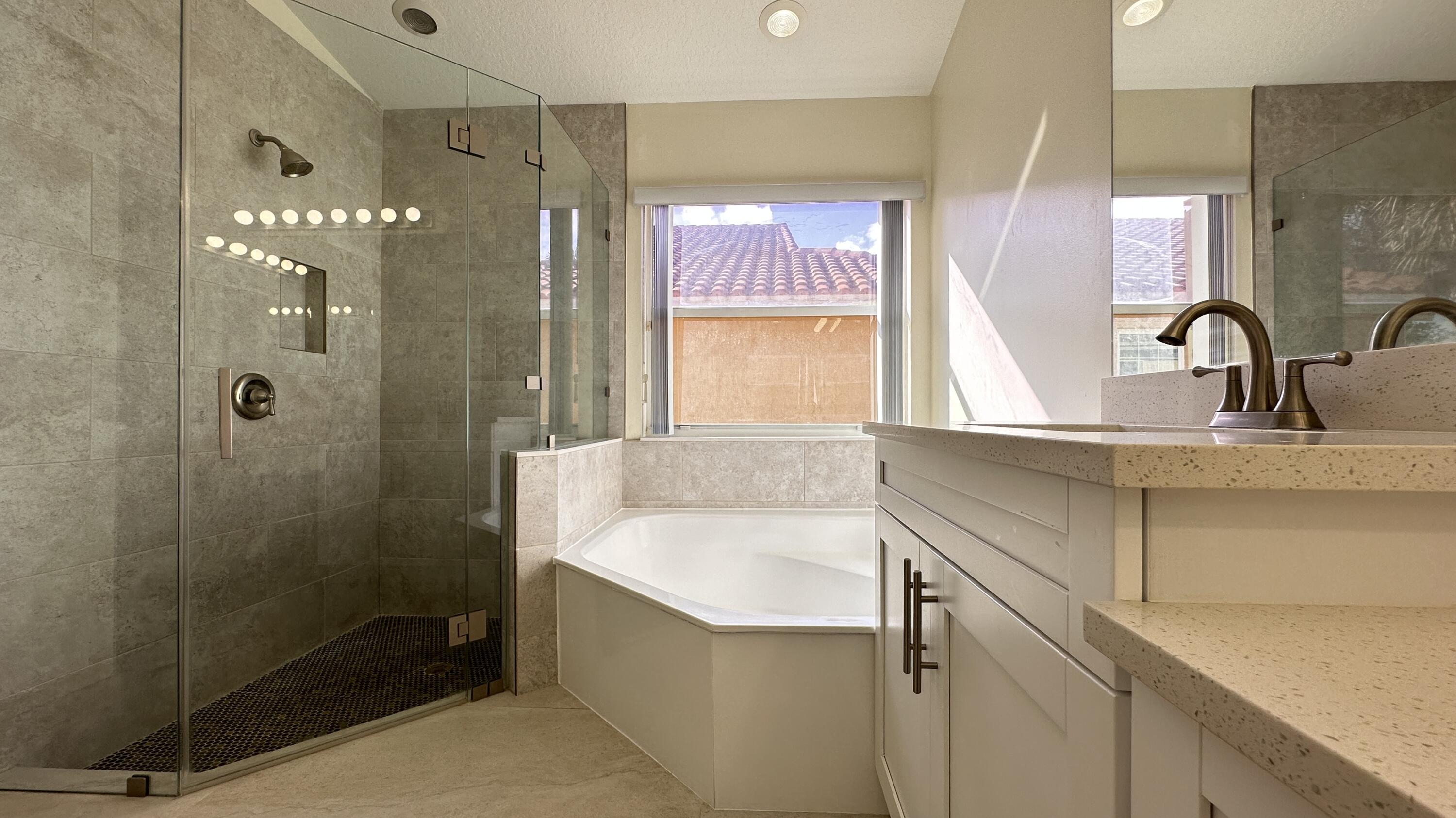19010 Southwest 10th Street Pembroke Pines, FL 33029 - Photo 42 of 59 a bathroom with a shower sink and mirror