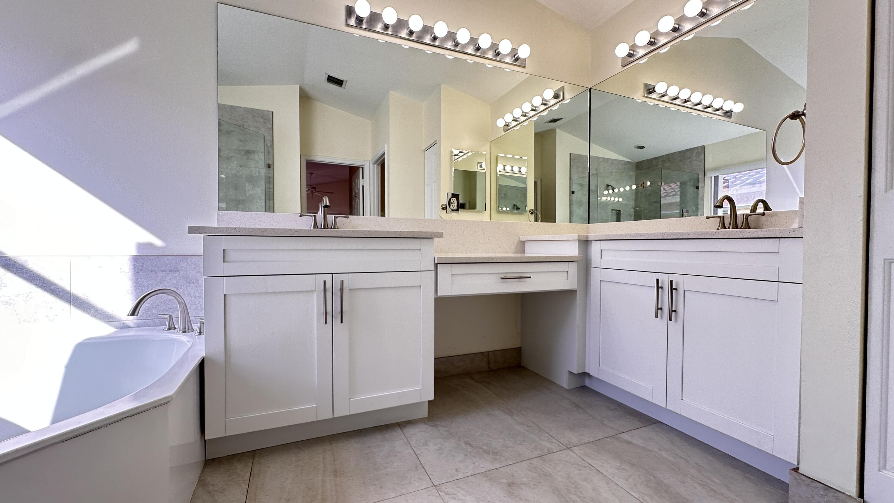 19010 Southwest 10th Street Pembroke Pines, FL 33029 - Photo 44 of 59 a spacious bathroom with a sink and a mirror