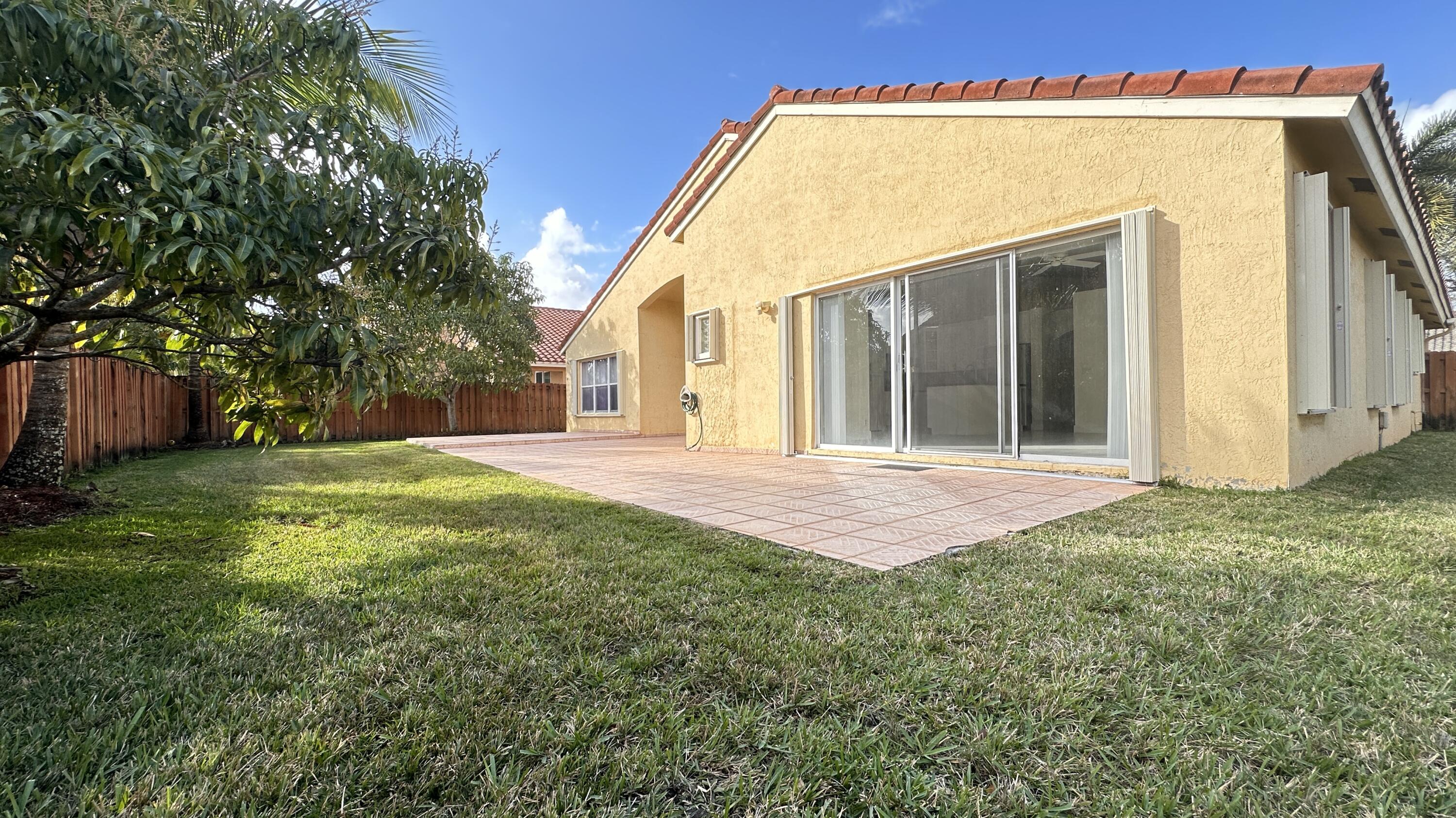 19010 Southwest 10th Street Pembroke Pines, FL 33029 - Photo 48 of 59 a view of a house with a backyard