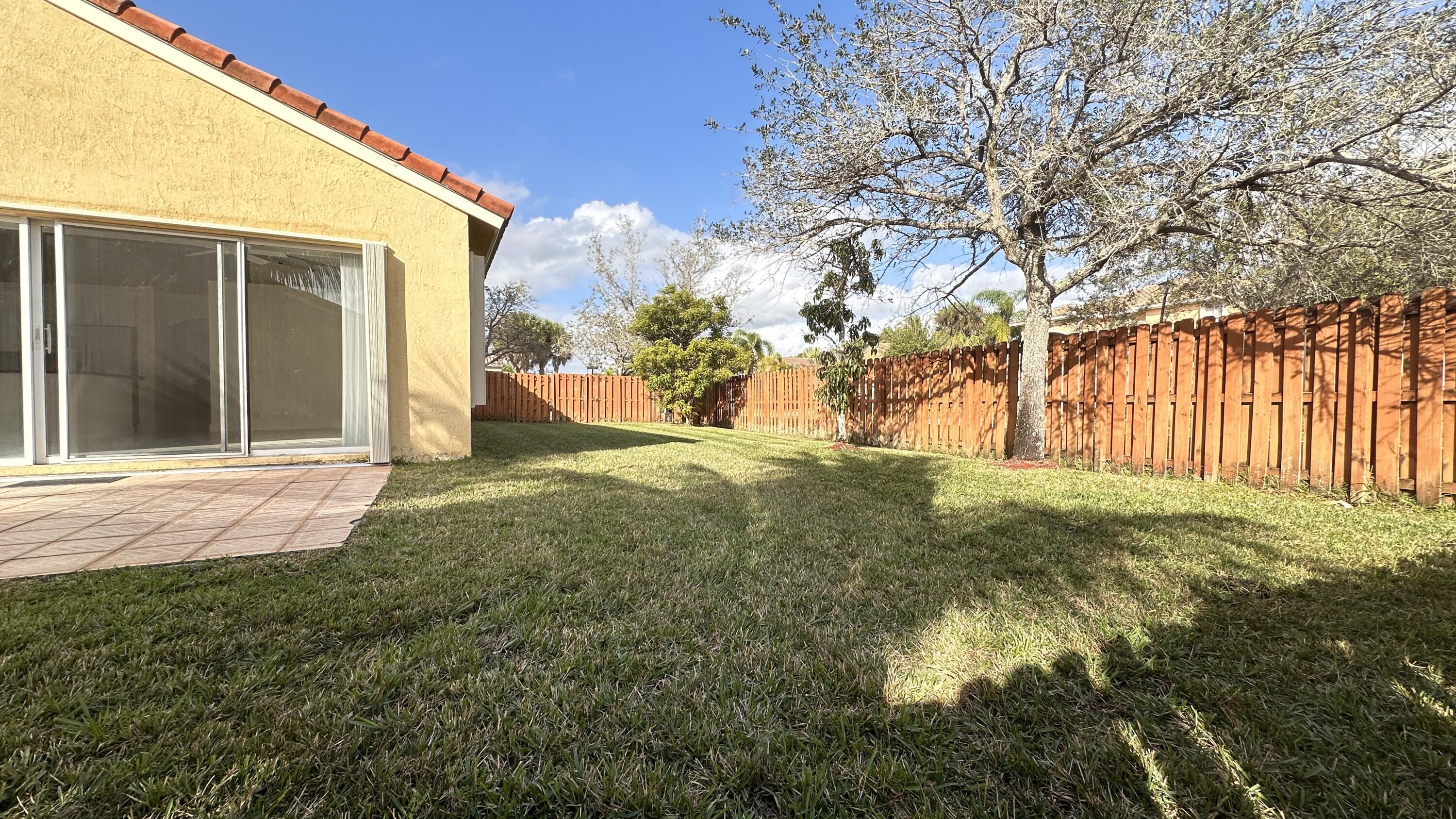19010 Southwest 10th Street Pembroke Pines, FL 33029 - Photo 50 of 59 a view of a backyard