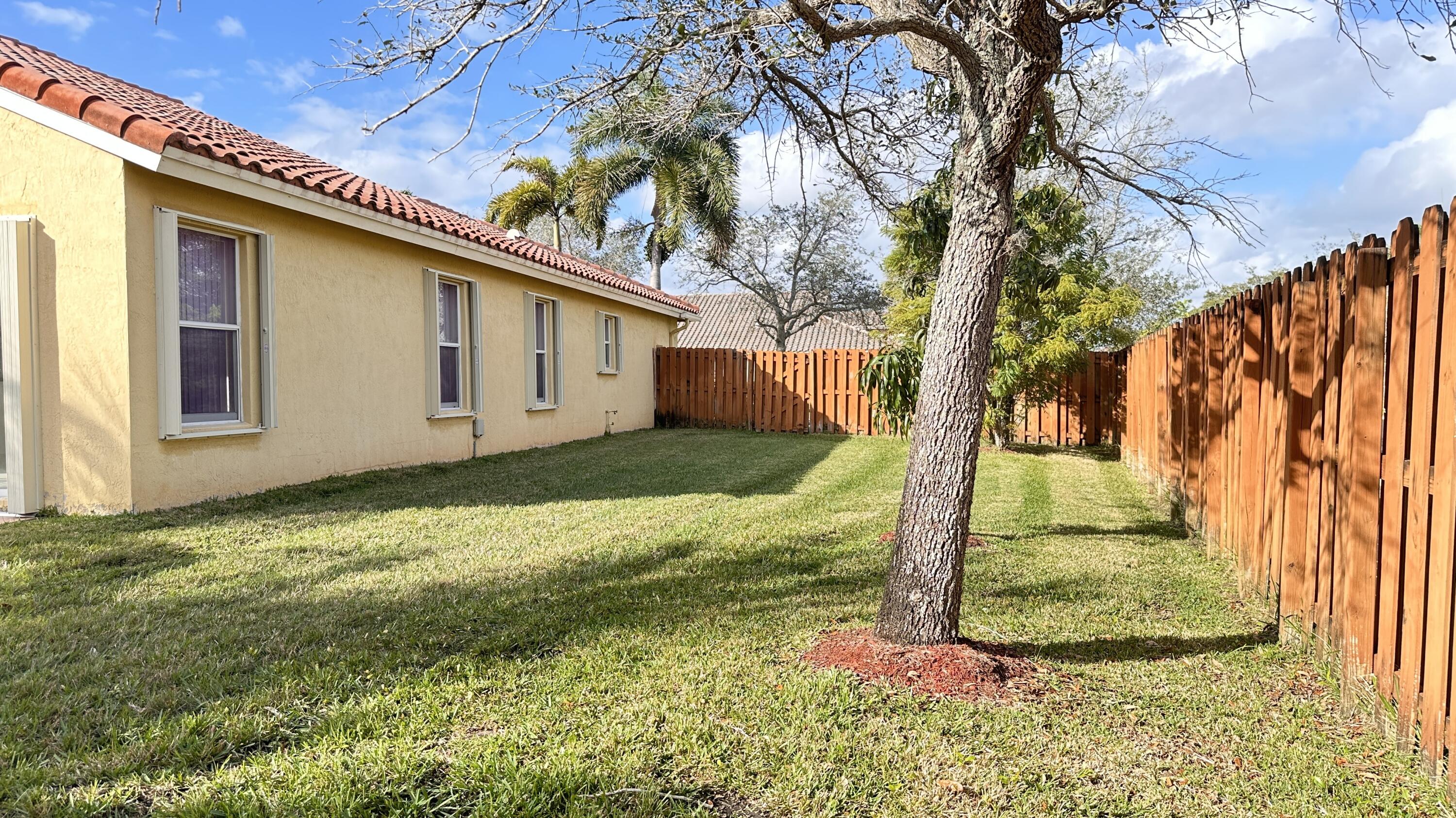 19010 Southwest 10th Street Pembroke Pines, FL 33029 - Photo 51 of 59 a view of a house with a yard