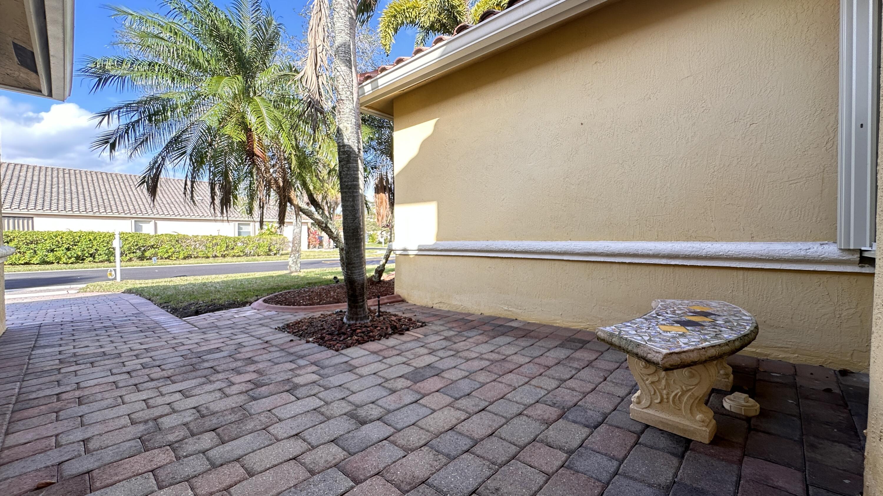 19010 Southwest 10th Street Pembroke Pines, FL 33029 - Photo 59 of 59 a view of a backyard with plants and palm tree