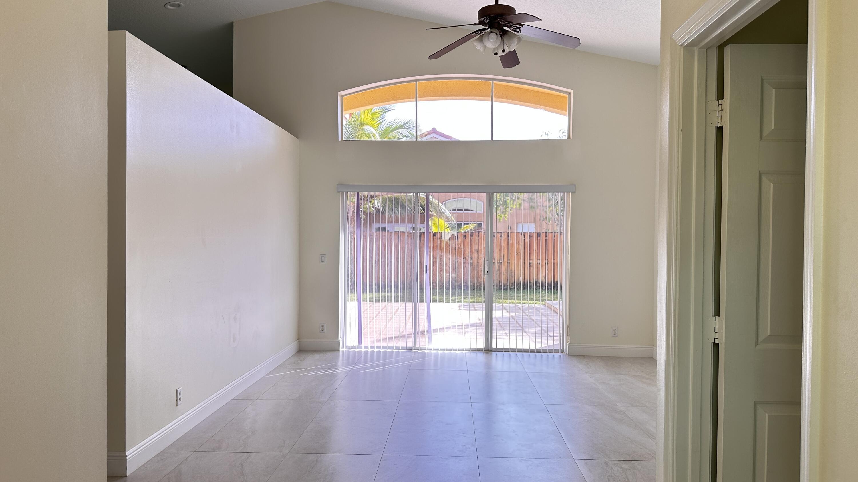 19010 Southwest 10th Street Pembroke Pines, FL 33029 - Photo 7 of 59 a view of a hallway with a large window and a mirror