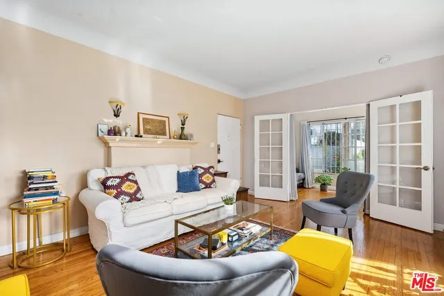a living room with fireplace furniture and a flat screen tv