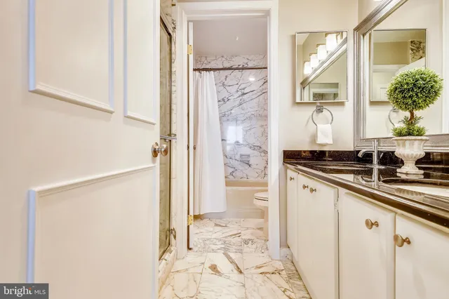a view of empty room with wooden floor and cabinet