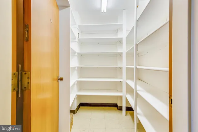 a open dining room with stainless steel appliances kitchen island granite countertop a dining table chairs and view living room