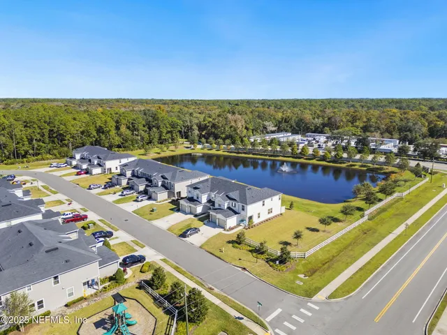 an aerial view of a house with a swimming pool