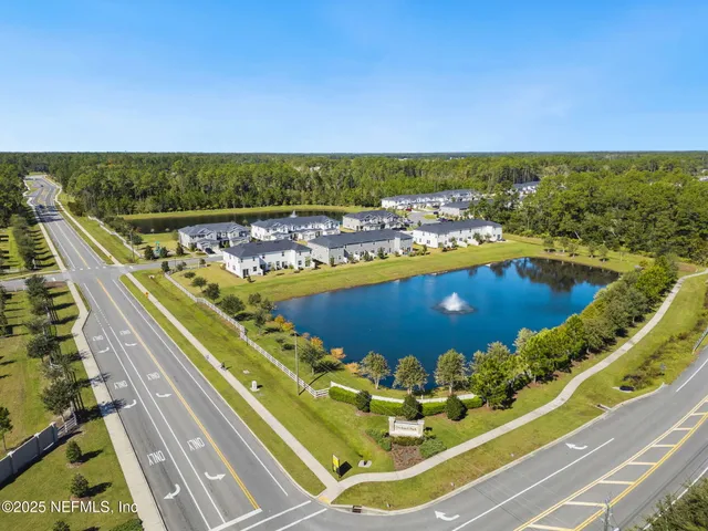 a view of a swimming pool with an outdoor seating