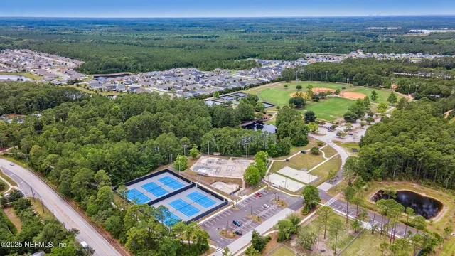 an aerial view of residential house with outdoor space