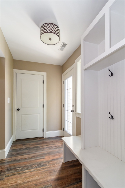 11 Leighton Street Natick, MA 01760 - Photo 11 of 27 a view of a room with wooden floor and window