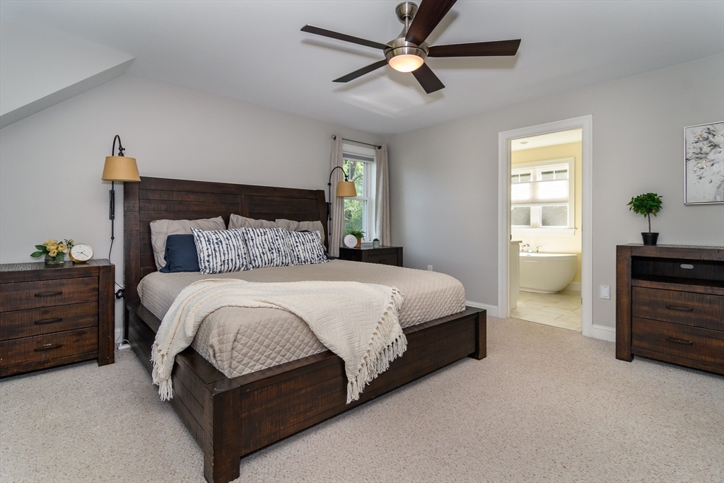 11 Leighton Street Natick, MA 01760 - Photo 13 of 27 a bedroom with a bed and a chandelier