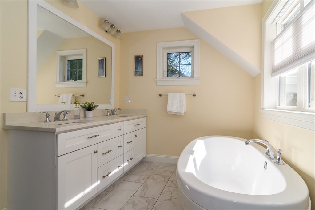 11 Leighton Street Natick, MA 01760 - Photo 15 of 27 a bathroom with a sink and a mirror