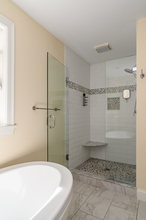 11 Leighton Street Natick, MA 01760 - Photo 16 of 27 a bathroom with a bathtub and a shower