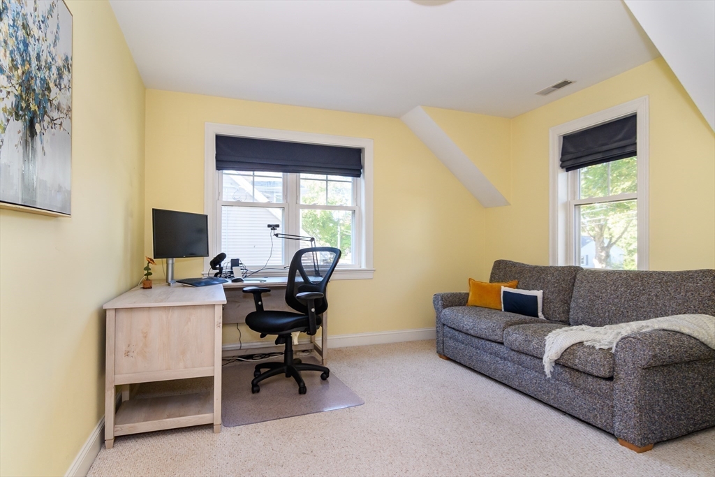 11 Leighton Street Natick, MA 01760 - Photo 20 of 27 a livingroom with workspace and a couch
