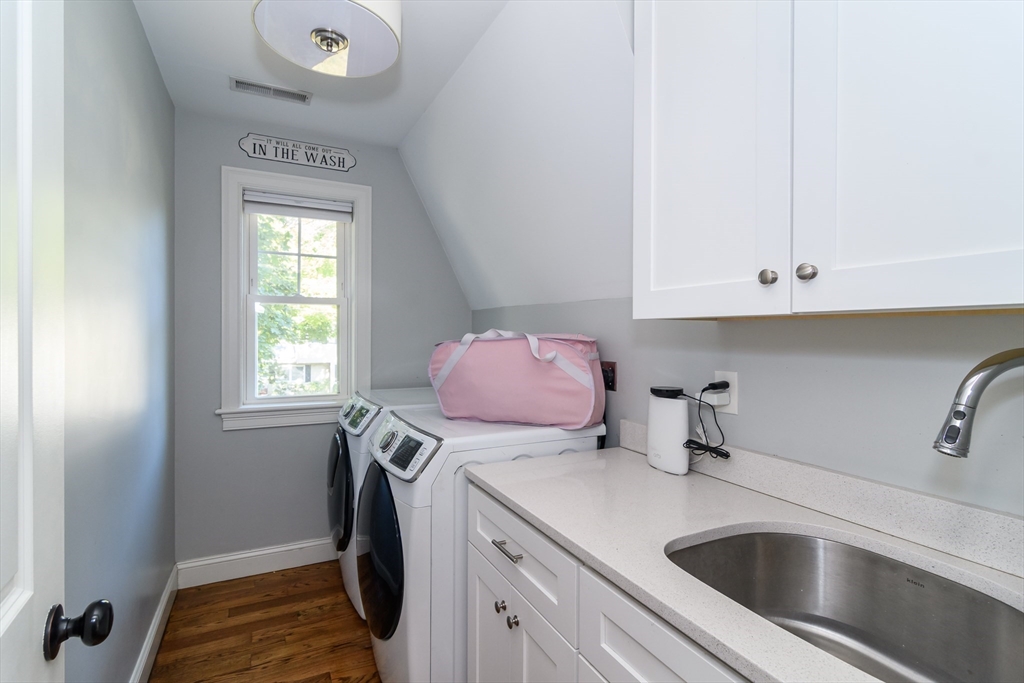 11 Leighton Street Natick, MA 01760 - Photo 23 of 27 a utility room with sink dryer and washer