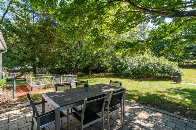 a view of a dinning table and chairs in the patio