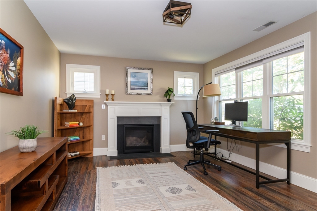 11 Leighton Street Natick, MA 01760 - Photo 8 of 27 a living room with furniture and a fireplace