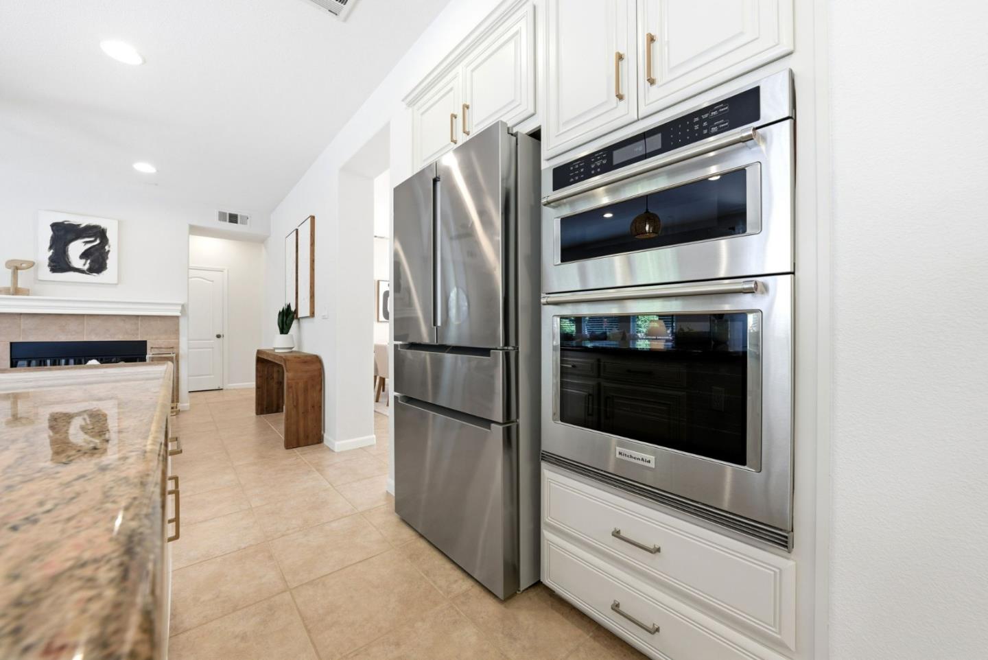 2556 Harlow Lane San Ramon, CA 94582 - Photo 13 of 62 a kitchen with granite countertop white cabinets and stainless steel appliances