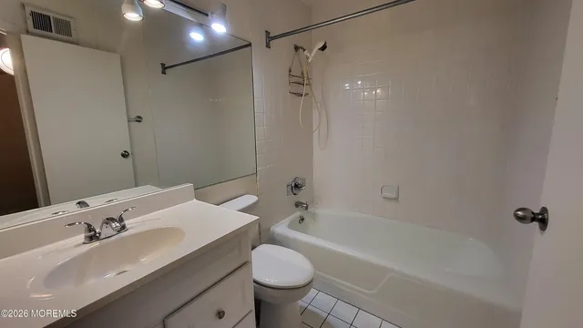 a view of an empty room with a fireplace