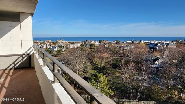 a kitchen with stainless steel appliances granite countertop a table chairs in it and wooden floors