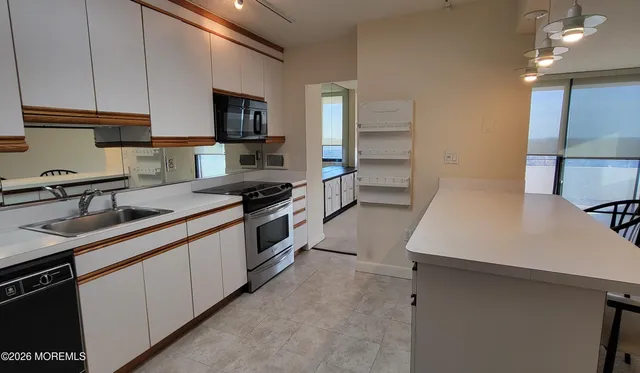 a bathroom with a sink toilet tub and shower