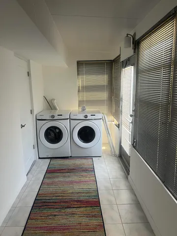 a view of livingroom with washer and dryer