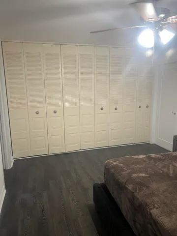 a bedroom with a bed and a cabinets