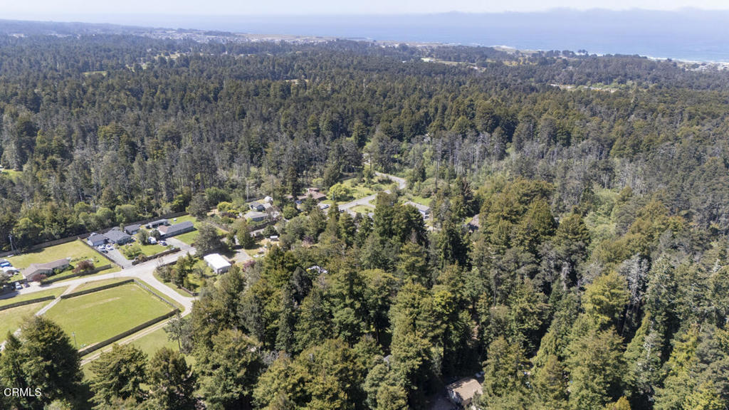 31320 Airport Road Fort Bragg, CA 95437 - Photo 14 of 14 an aerial view of residential house with yard and mountain view in back