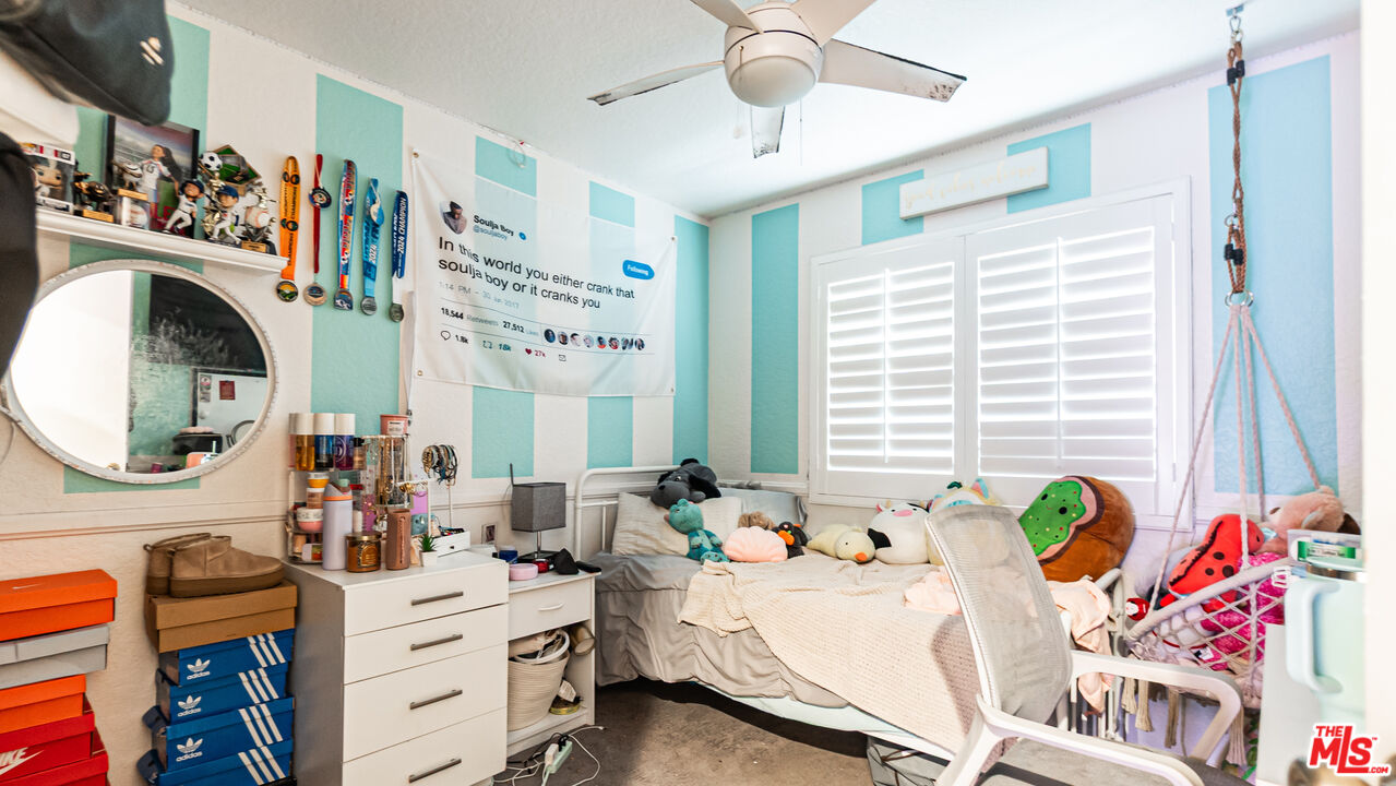 69817 Brookview Way Cathedral City, CA 92234 - Photo 17 of 38 a living room with furniture and a large window