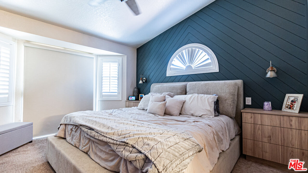 69817 Brookview Way Cathedral City, CA 92234 - Photo 18 of 38 a bedroom with a bed and a window
