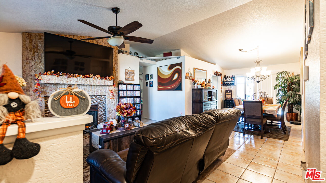 69817 Brookview Way Cathedral City, CA 92234 - Photo 2 of 38 a living room with furniture and a flat screen tv