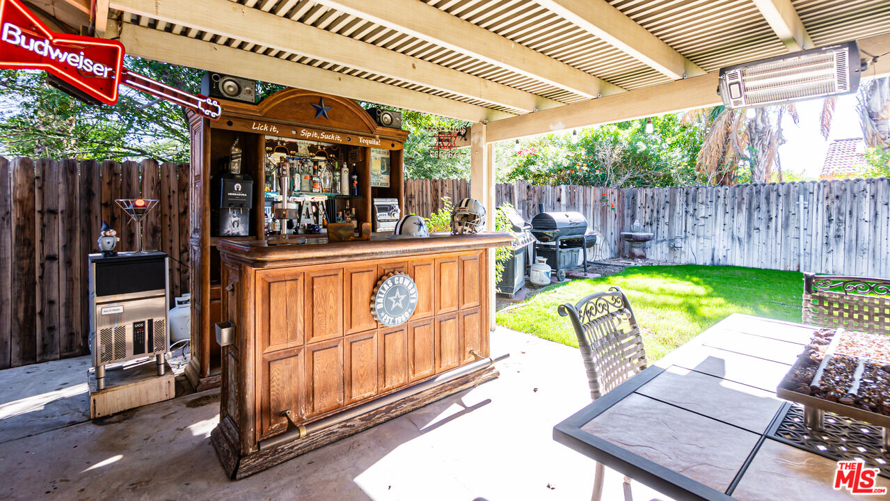 69817 Brookview Way Cathedral City, CA 92234 - Photo 24 of 38 a view of a backyard with a tub and wooden fence