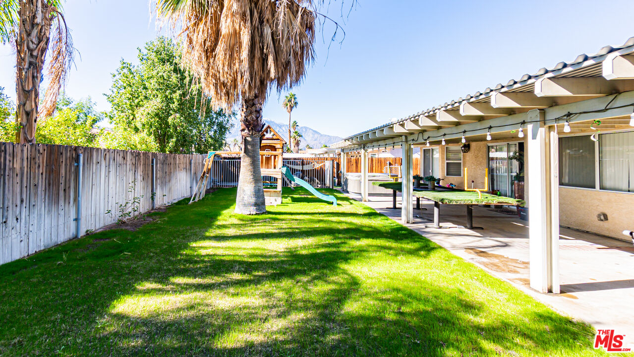 69817 Brookview Way Cathedral City, CA 92234 - Photo 28 of 38 a swimming pool with yard and outdoor seating