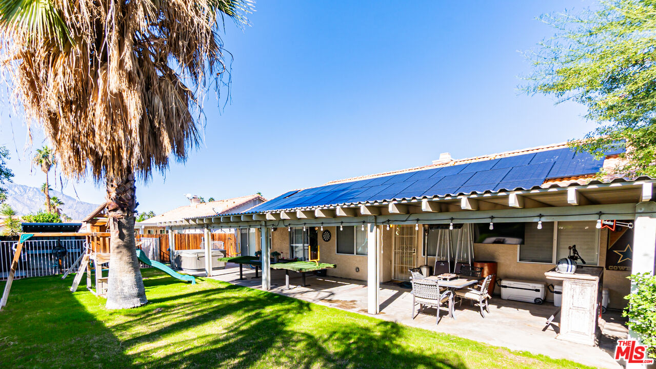 69817 Brookview Way Cathedral City, CA 92234 - Photo 29 of 38 a view of a chairs and table in a patio