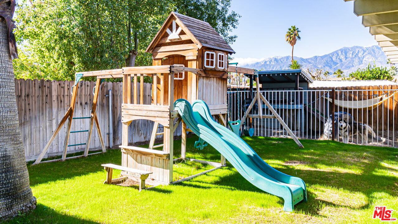 69817 Brookview Way Cathedral City, CA 92234 - Photo 31 of 38 a view of a house with backyard and deck