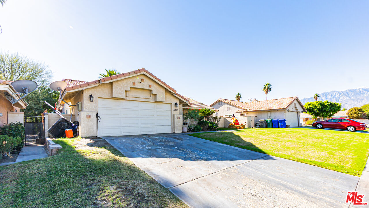 69817 Brookview Way Cathedral City, CA 92234 - Photo 36 of 38 a view of front of house with a yard