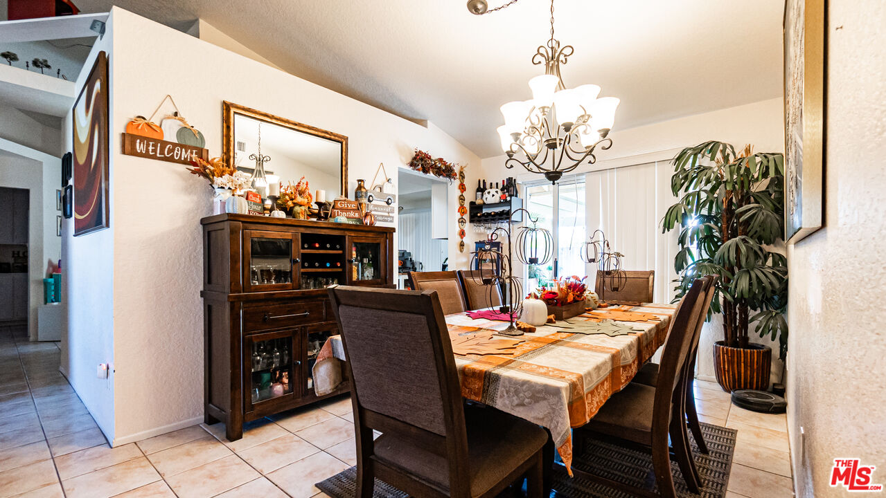 69817 Brookview Way Cathedral City, CA 92234 - Photo 6 of 38 a view of a dining room with furniture and chandelier