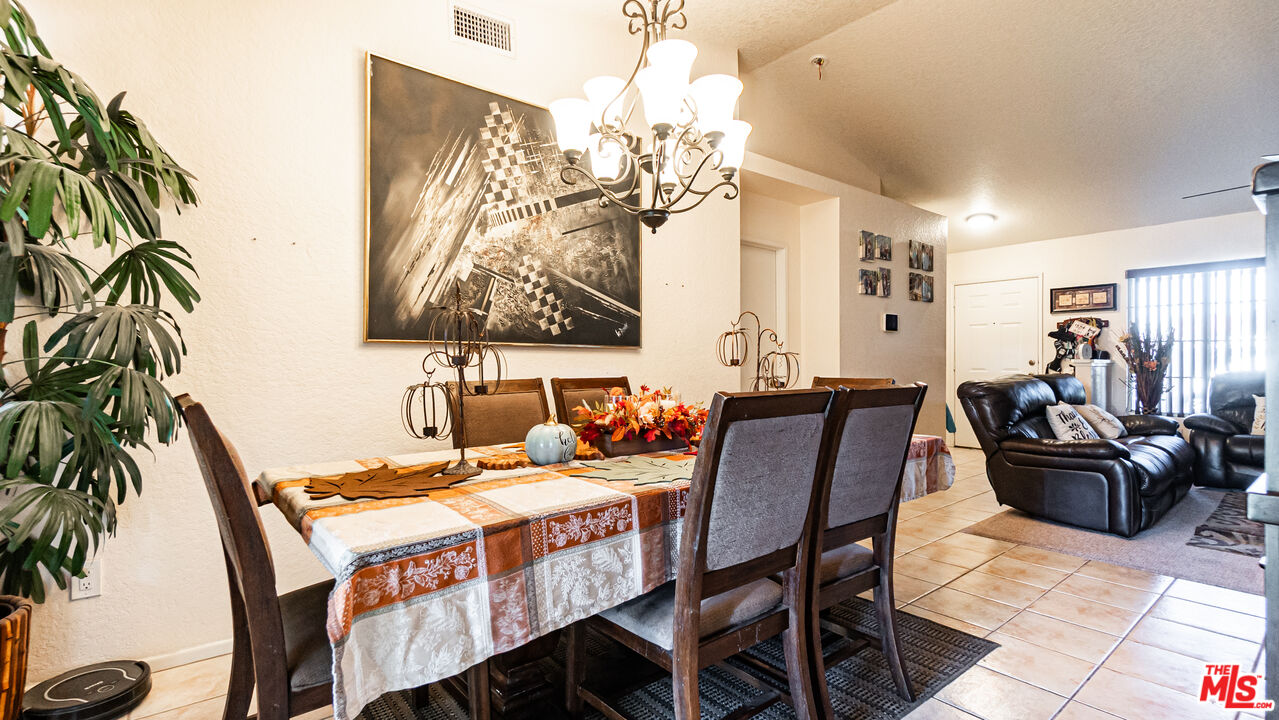 69817 Brookview Way Cathedral City, CA 92234 - Photo 7 of 38 a view of a dining room with furniture and chandelier