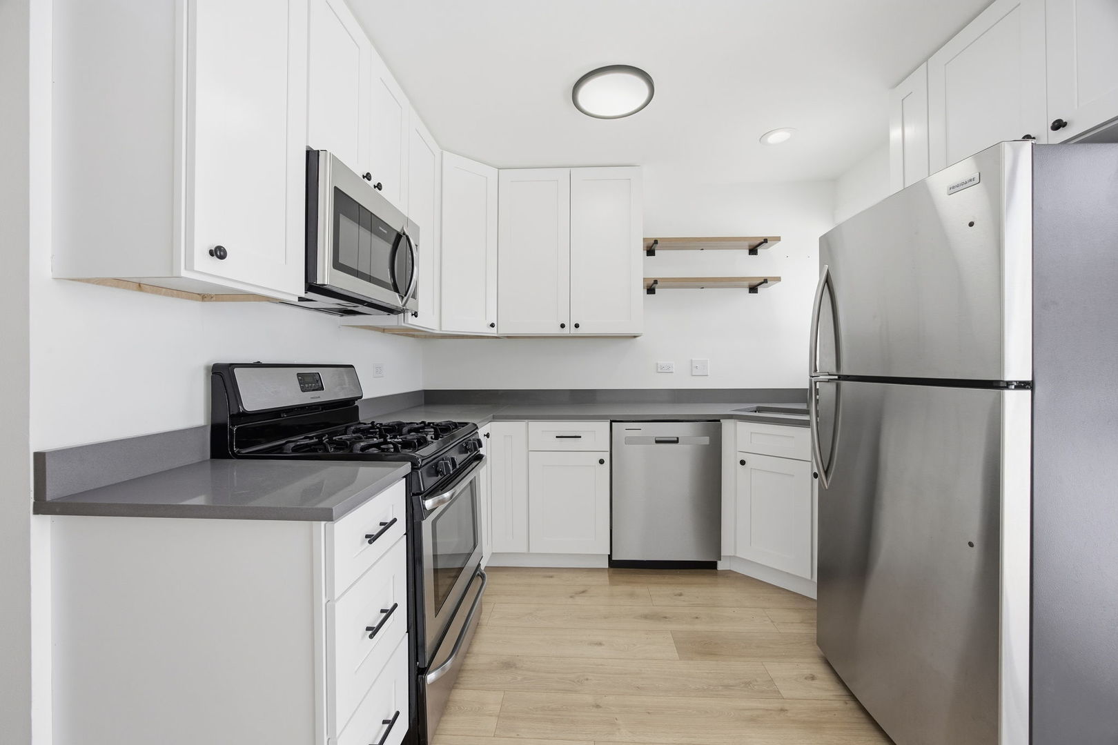 4654 West 131st Street, Unit 1S Alsip, IL 60803 - Photo 3 of 10 a kitchen with stainless steel appliances granite countertop a refrigerator a stove a sink and a granite counter tops