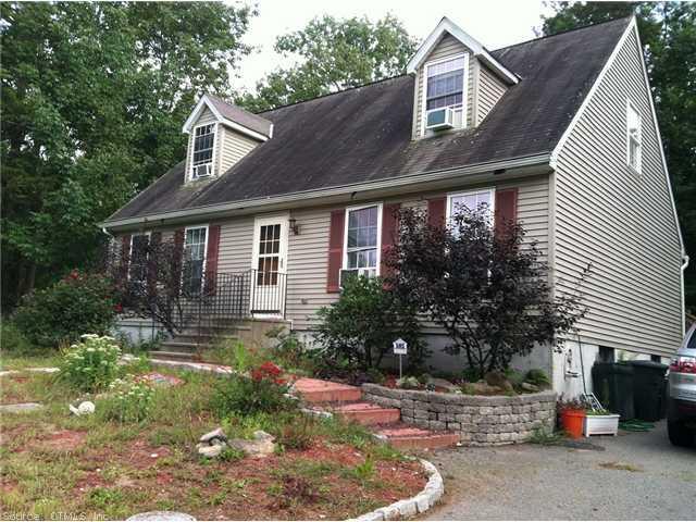 207 Dow Road Plainfield, CT 06374 - Photo 1 of 1 a front view of a house with garden
