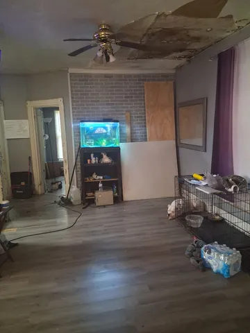 a kitchen with granite countertop a sink and cabinets