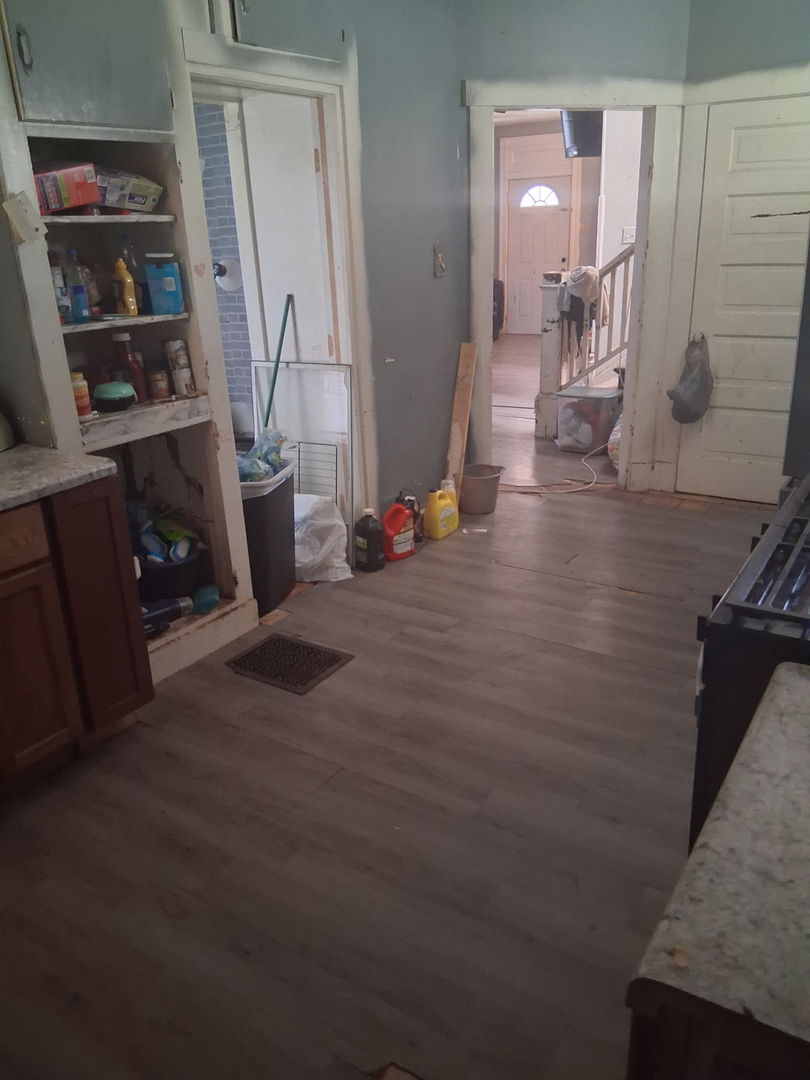 441 South Seigel Street Decatur, IL 62522 - Photo 6 of 7 a view of a hallway with workspace and wooden floor
