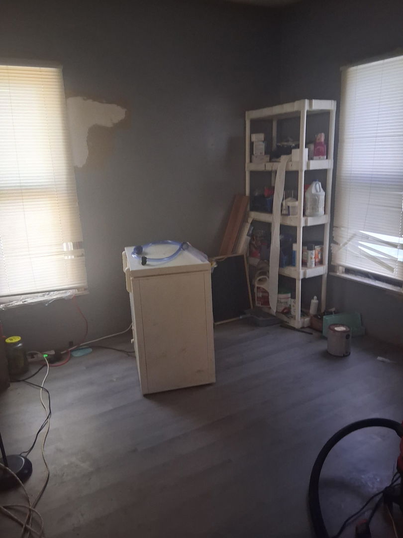 441 South Seigel Street Decatur, IL 62522 - Photo 7 of 7 a room with a chair and white walls