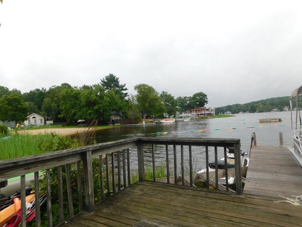 74 Union Road Wales, MA 01081 - Photo 12 of 14 a balcony with wooden floor and lake view