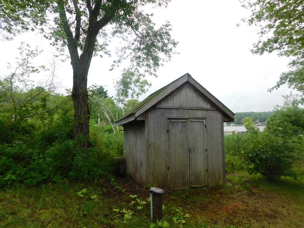 74 Union Road Wales, MA 01081 - Photo 14 of 14 a wooden door in a backyard