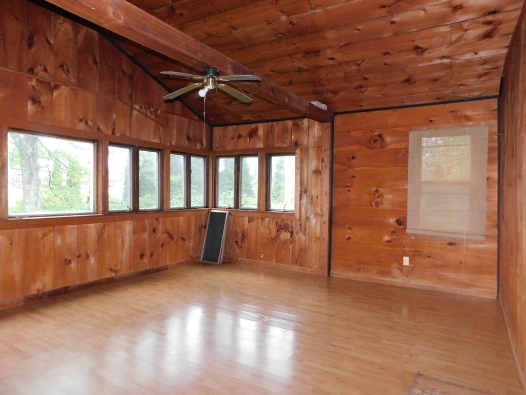 74 Union Road Wales, MA 01081 - Photo 8 of 14 an empty room with wooden floor and windows