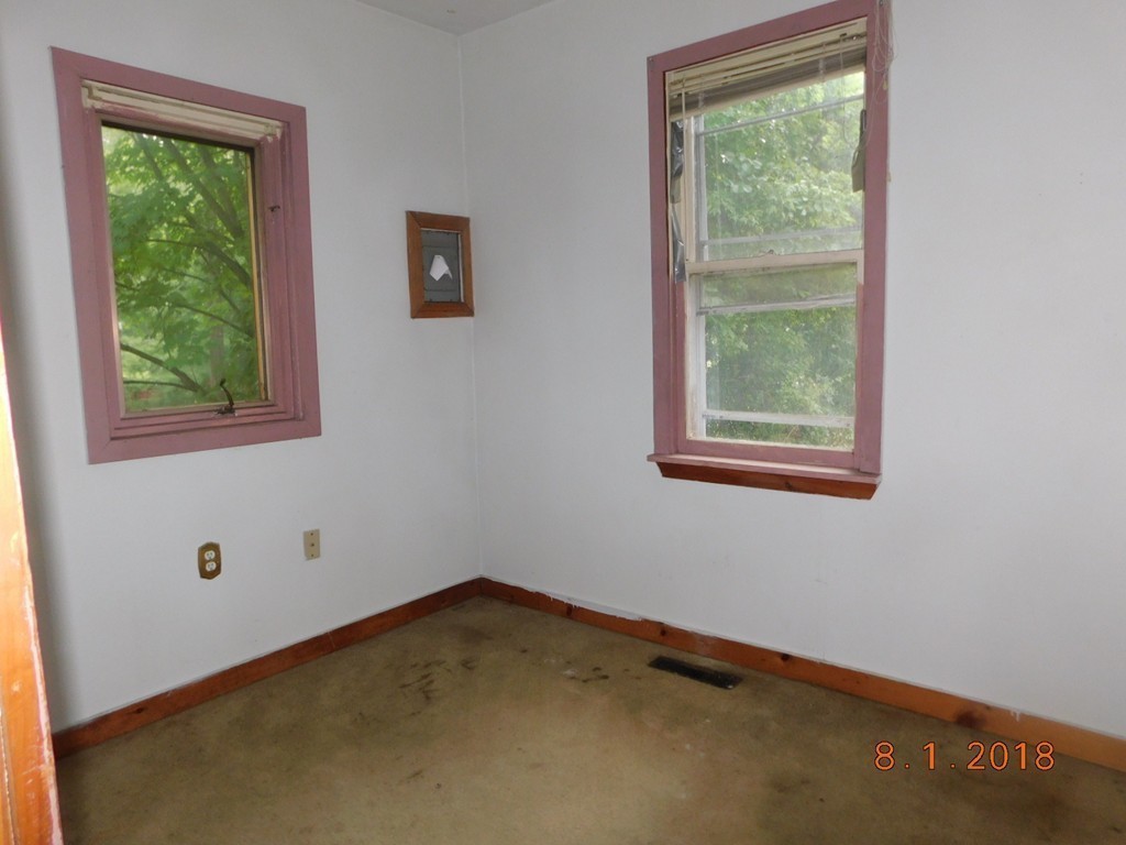 74 Union Road Wales, MA 01081 - Photo 10 of 14 an empty room with a window