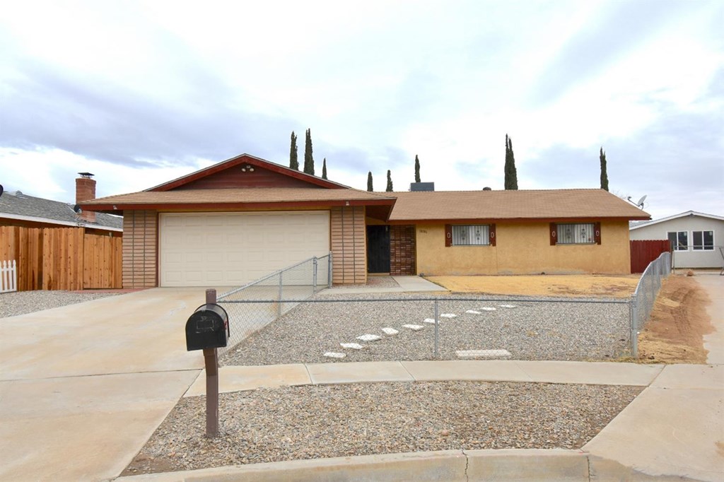18186 Lilac Road Adelanto, CA 92301 - Photo 1 of 1 a front view of a house with garden