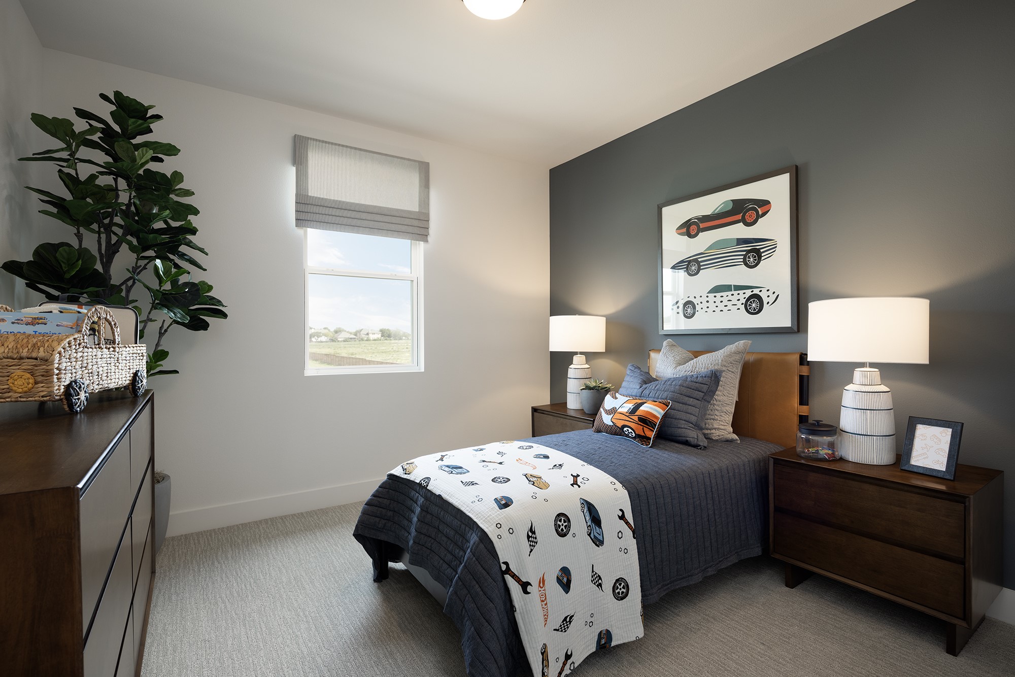 270 Romans Road Kyle, TX 78640 - Photo 12 of 23 a bedroom with bed and a potted plant